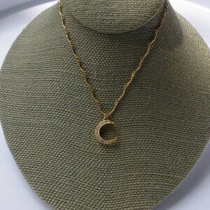 Women`s gold tone and clear crystals crescent moon